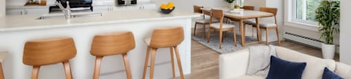 a living room with a kitchen and a dining room