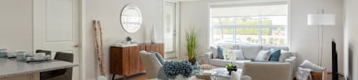 The Conservatory open concept suite with view of living room from dining area in Kelowna, BC