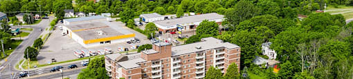 Trillium Apartments drone image of building in Cobourg, ON