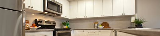 Trillium Apartments modern kitchen with hardwood flooring in Cobourg, ON