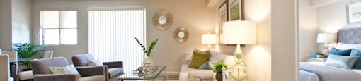 Trillium Apartments elegant living room with access to balcony in Cobourg, ON