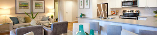 Trillium Apartments cozy dining area with view into kitchen and living room in Cobourg, ON