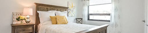 Trio On Belmont cozy bedroom with luxury plank flooring in Kitchener, ON