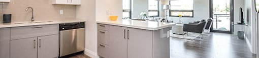 Trio On Belmont kitchen with built-in breakfast bar and quartz countertops in Kitchener, ON