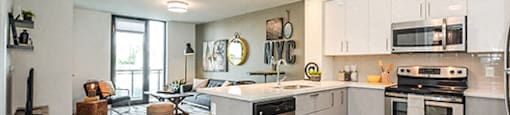 Trio On Belmont open concept kitchen with view of living room in Kitchener, ON