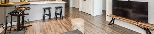 Trio On Belmont spacious living room with view of kitchen in Kitchener, ON