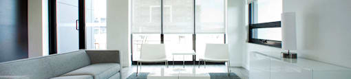 Trio On Belmont social room with big windows and seating area in Kitchener, ON