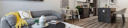 a living room with a couch and a table at Vale Station Apartments in Waterloo ON