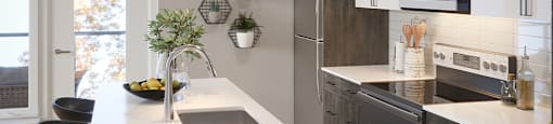 Kitchen with stainless steel appliances at Vale Station Apartments in Waterloo ON