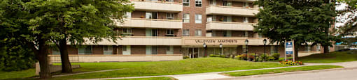Exterior of Valleyview from the street, showcasing the architecture and beautiful trees