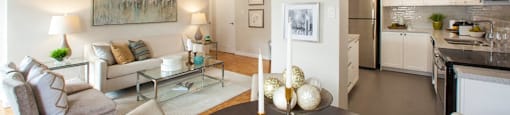 Valleyview Dining room with view of the kitchen on the right side and the living room on the left. Candles are in the center of the dining room table in Newmarket, ON