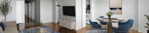 A modern living room and dining room with hardwood flooring at Village Tower Toronto ON