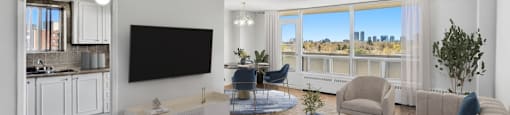 A modern living room and dining room with hardwood flooring at Village Tower Toronto ON