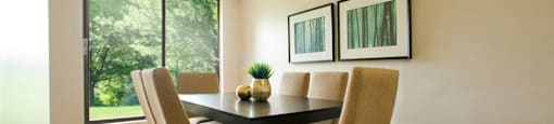 Squire Court large dining area with hard surface flooring and access to balcony in St. Catharines, ON