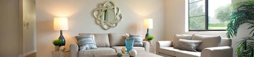 Squire Court modern living room with large window in St. Catharines, ON