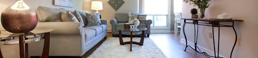 London Road Apartments living room with access to balcony in Sarnia, ON