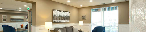 Juliana Place Apartments lobby featuring lounge seating and fireplace in Woodstock, ON