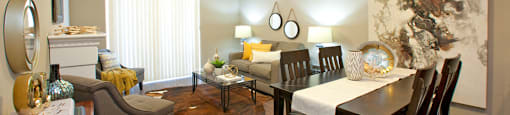 Juliana Place Apartments dining room and living room featuring luxury vinyl flooring in Woodstock, ON