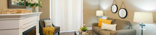 Juliana Place Apartments living room featuring fireplace in Woodstock, ON