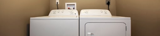 Juliana Place Apartments in-suite laundry featuring washer and dryer in Woodstock, ON