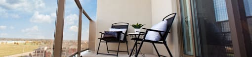 Juliana Place Apartments balcony featuring glass barrier in Woodstock, ON