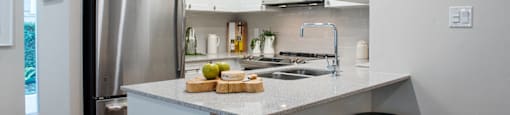 Wesley Place in Vancouver, BC Two bedroom townhouse kitchen featuring stainless steel appliances