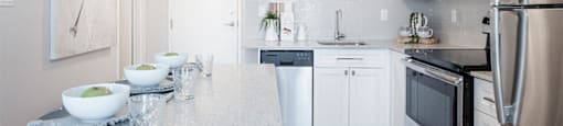Wesley Place in Vancouver, BC Bright and airy kitchen with floating island