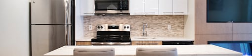 Wesley Place in Vancouver, BC Social room kitchen with upgraded island bar