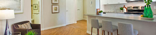 Whitby Place in Whitby, ON well lit living room and kitchen