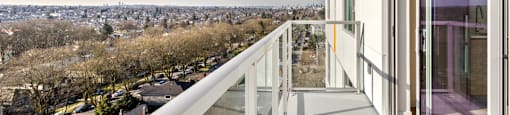 A balcony with a view of a cityscape.
