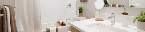 Yello On Yates modern bathroom with full size bathtub in Vancouver, BC