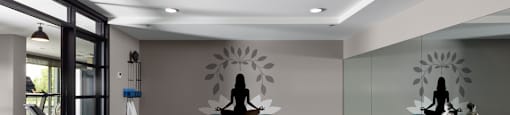 A yoga studio with blue mats and yoga blocks at The Ambrosi in Kelowna, BC.
