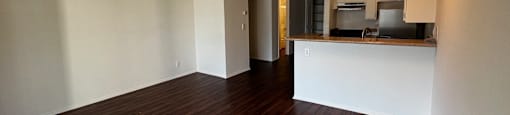 A room with wooden floors and white walls.