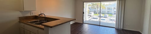 A kitchen with a sink and a window.