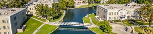a view of a lake with a bridge in the middle of it