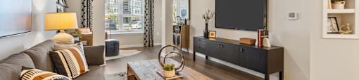 Langley Pointe Apartments | Living Rooms w/ Sunrooms