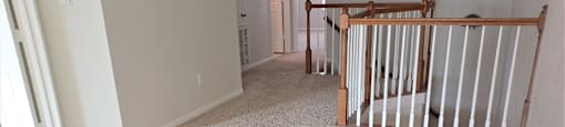 A baby's room with a crib and a carpet.