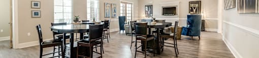 A dining room with a table set for six.