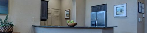 A reception area with a counter and a pineapple on it.
