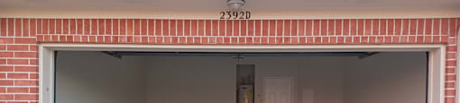 A garage with the number 2392D on the wall above it.
