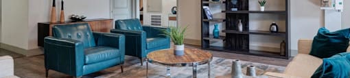 A living room with a blue couch and a coffee table.