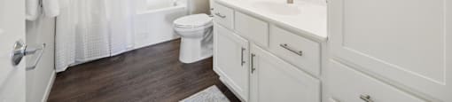 a bathroom with a large mirror and a lot of storage