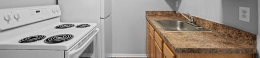 our apartments have a kitchen with a stove refrigerator and sink