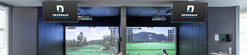 A room with a Devereaux sign on the wall and a large screen showing a golf game.