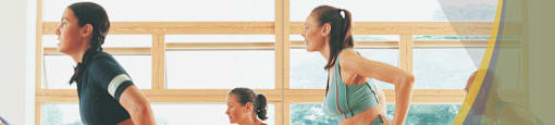 a group of women doing aerobic exercises in a gym