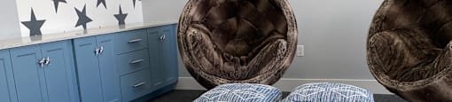 a group of stuffed sheep laying on a bed in a room