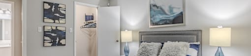 a bedroom with a large bed and a closet