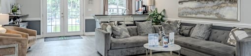 a living room with couches and a coffee table