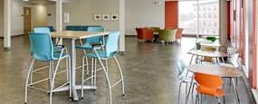 A room with tables and chairs.