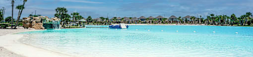 a large body of water with a sandy beach